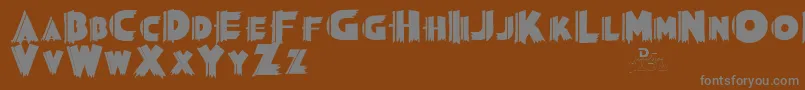 Grauman-fontti – harmaat kirjasimet ruskealla taustalla