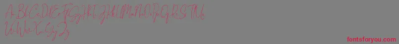 Gravity Handwritten-Schriftart – Rote Schriften auf grauem Hintergrund