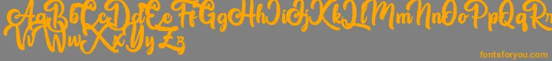 Great Himalaya-Schriftart – Orangefarbene Schriften auf grauem Hintergrund