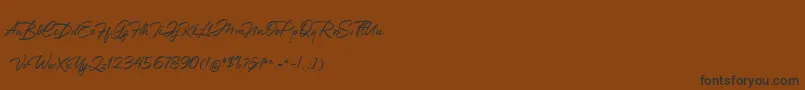 Greathfella Font – Black Fonts on Brown Background