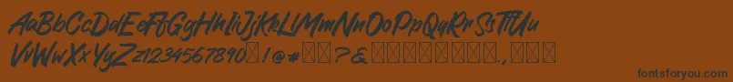 GreattongBrush Font – Black Fonts on Brown Background