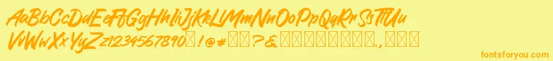 GreattongBrush Font – Orange Fonts on Yellow Background