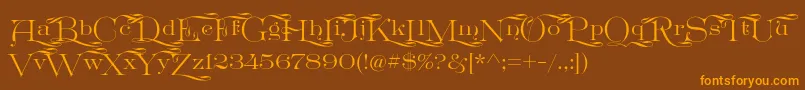 Шрифт GreatVictorian Swashed – оранжевые шрифты на коричневом фоне