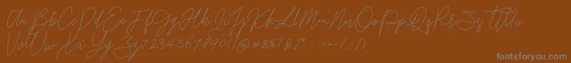 Gredom Monoline-Schriftart – Graue Schriften auf braunem Hintergrund