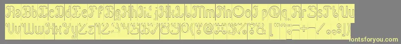 Green Avocado Hollow Inverse-Schriftart – Gelbe Schriften auf grauem Hintergrund