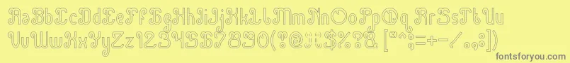 Green Avocado Hollow-fontti – harmaat kirjasimet keltaisella taustalla