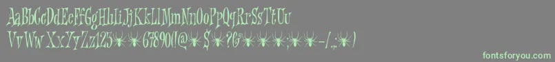 Griezelig DEMO-Schriftart – Grüne Schriften auf grauem Hintergrund