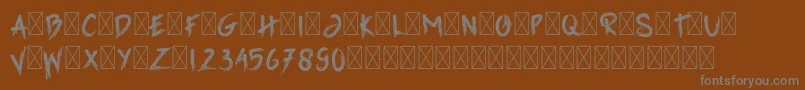 GrimReaper-fontti – harmaat kirjasimet ruskealla taustalla