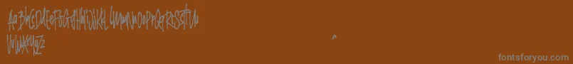 Grinty FREE Font – Gray Fonts on Brown Background