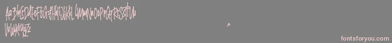 Grinty FREE-Schriftart – Rosa Schriften auf grauem Hintergrund