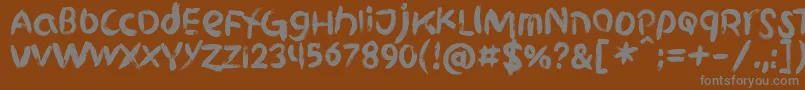 フォントGriphite PERSONAL USE – 茶色の背景に灰色の文字