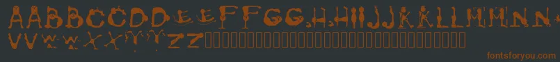 Шрифт GroversPain Regular – коричневые шрифты на чёрном фоне