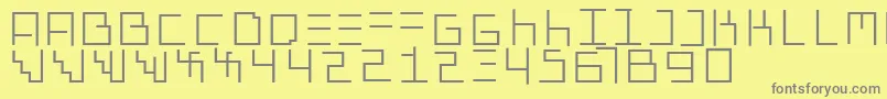 Genotypiprototype-fontti – harmaat kirjasimet keltaisella taustalla