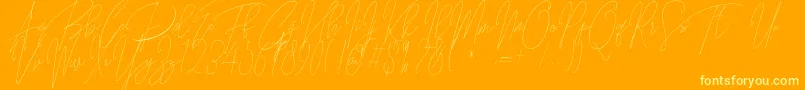 Guitarist Free Font – Yellow Fonts on Orange Background