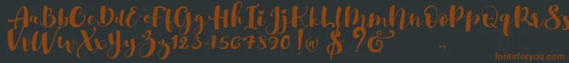 More about Gulya Script Font Gulya Script Font – Brown Fonts on Black Background