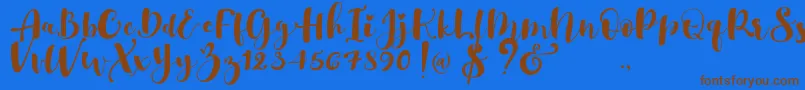 Gulya Script  -Schriftart – Braune Schriften auf blauem Hintergrund
