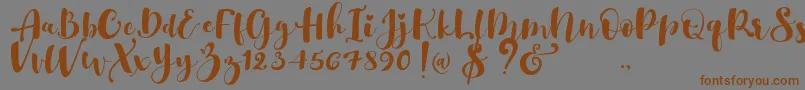 fuente Gulya Script   – Fuentes Marrones Sobre Fondo Gris