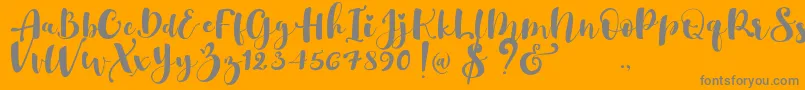 Saiba mais sobre a fonte Gulya Script   Fonte Gulya Script   – fontes cinzas em um fundo laranja