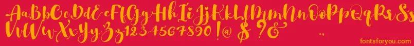 Gulya Script  -fontti – oranssit fontit punaisella taustalla