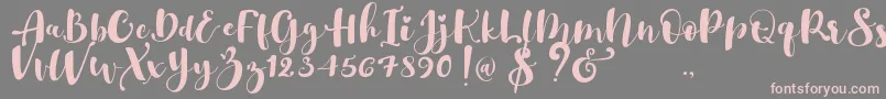 Gulya Script  -Schriftart – Rosa Schriften auf grauem Hintergrund