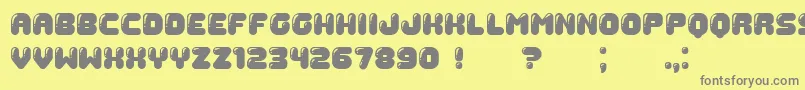 Gummy-fontti – harmaat kirjasimet keltaisella taustalla