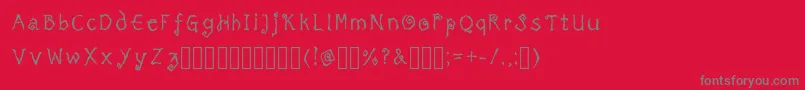 TricktreatsleepRegularRegular-Schriftart – Graue Schriften auf rotem Hintergrund