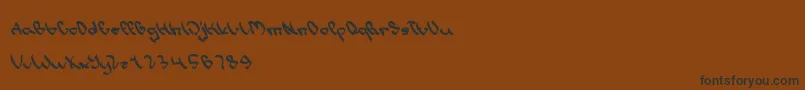 フォントWriteALetter – 黒い文字が茶色の背景にあります