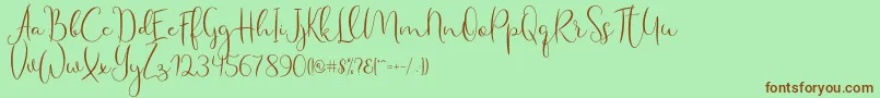 Fonte Haertbel Script – fontes marrons em um fundo verde