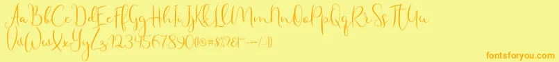 Fonte Haertbel Script – fontes laranjas em um fundo amarelo