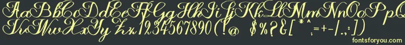 Halfesika Script Font – Yellow Fonts on Black Background