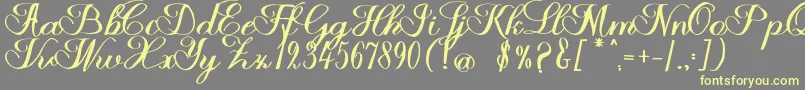 Halfesika Script Font – Yellow Fonts on Gray Background