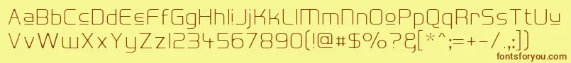 フォントHall Fetica Upper Decompose – 茶色の文字が黄色の背景にあります。