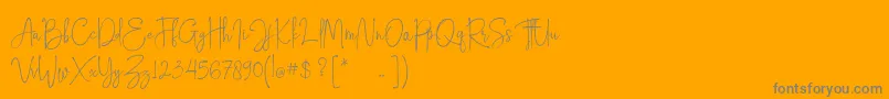 Hampton free personal use-Schriftart – Graue Schriften auf orangefarbenem Hintergrund