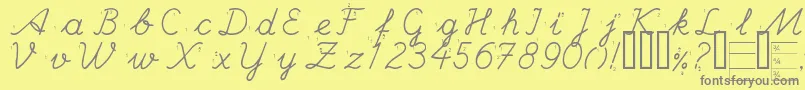 HANDE   -fontti – harmaat kirjasimet keltaisella taustalla