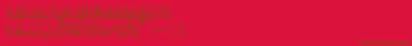 Handnilo Font – Brown Fonts on Red Background