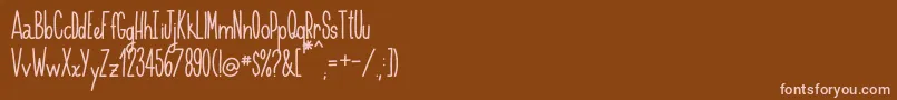 Handnilo Font – Pink Fonts on Brown Background