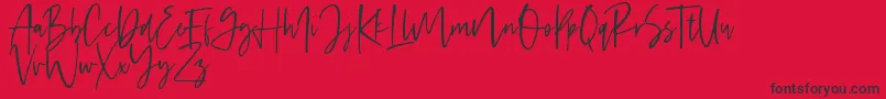 Handsel-Schriftart – Schwarze Schriften auf rotem Hintergrund