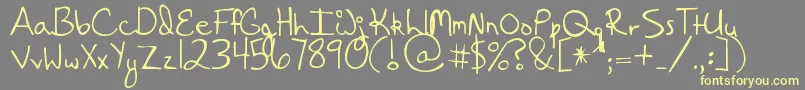 HangingByaThread Font – Yellow Fonts on Gray Background