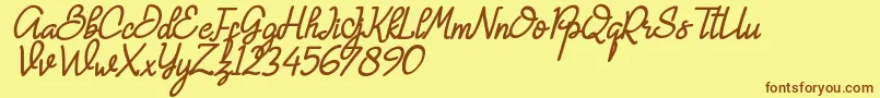 フォントHanna Monica – 茶色の文字が黄色の背景にあります。