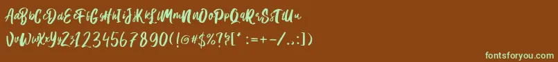 フォントHanomali Demo – 緑色の文字が茶色の背景にあります。