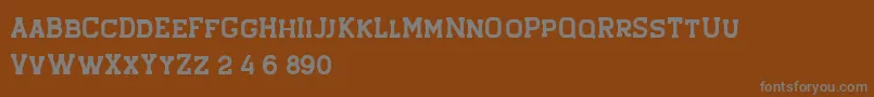 Czcionka Hansel Rough – szare czcionki na brązowym tle