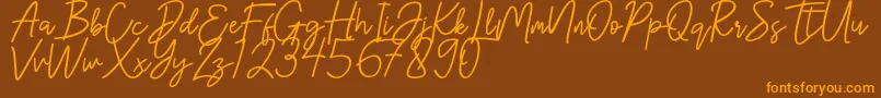 フォントHanster – オレンジ色の文字が茶色の背景にあります。