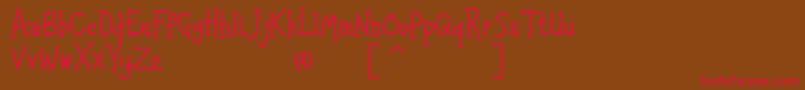 フォントHAPPYK 1 – 赤い文字が茶色の背景にあります。