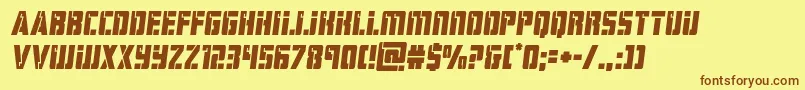 フォントhardsciencesemital – 茶色の文字が黄色の背景にあります。