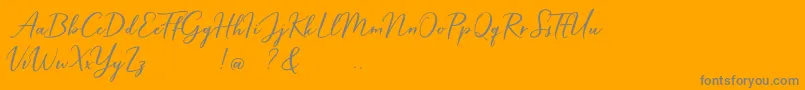 Hardwired Script Free-Schriftart – Graue Schriften auf orangefarbenem Hintergrund