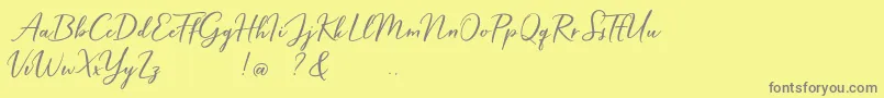 Fonte Hardwired Script Free – fontes cinzas em um fundo amarelo