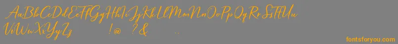 Hardwired Script Free-Schriftart – Orangefarbene Schriften auf grauem Hintergrund
