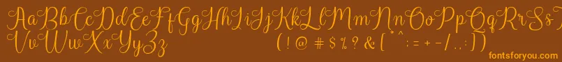 Harland Reguler Demo Font – Orange Fonts on Brown Background