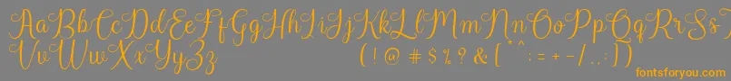 Harland Reguler Demo Font – Orange Fonts on Gray Background