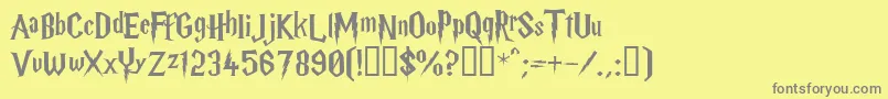 HARRYP  -fontti – harmaat kirjasimet keltaisella taustalla